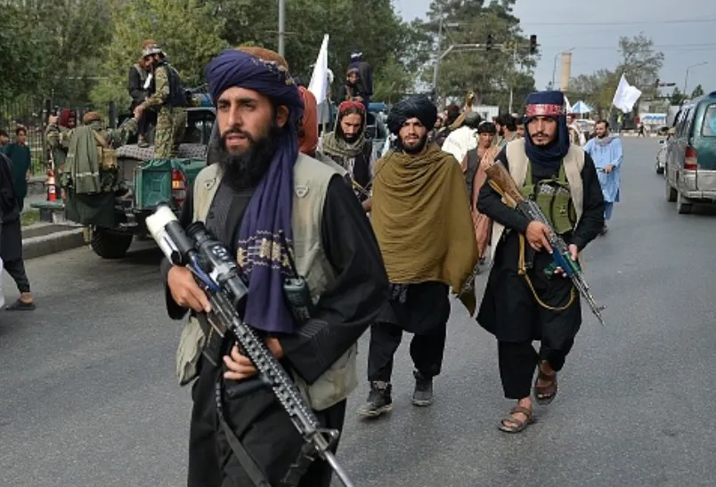 Taliban fighters gather along a street during a rally in Kabul on August 31, 2021 as they celebrate after the U.S. pulled all its troops out of the country to end a brutal 20-year war.?w=200&h=150